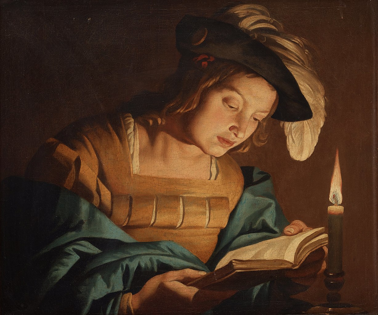 images/Boy_reading_by_candlelight.jpg