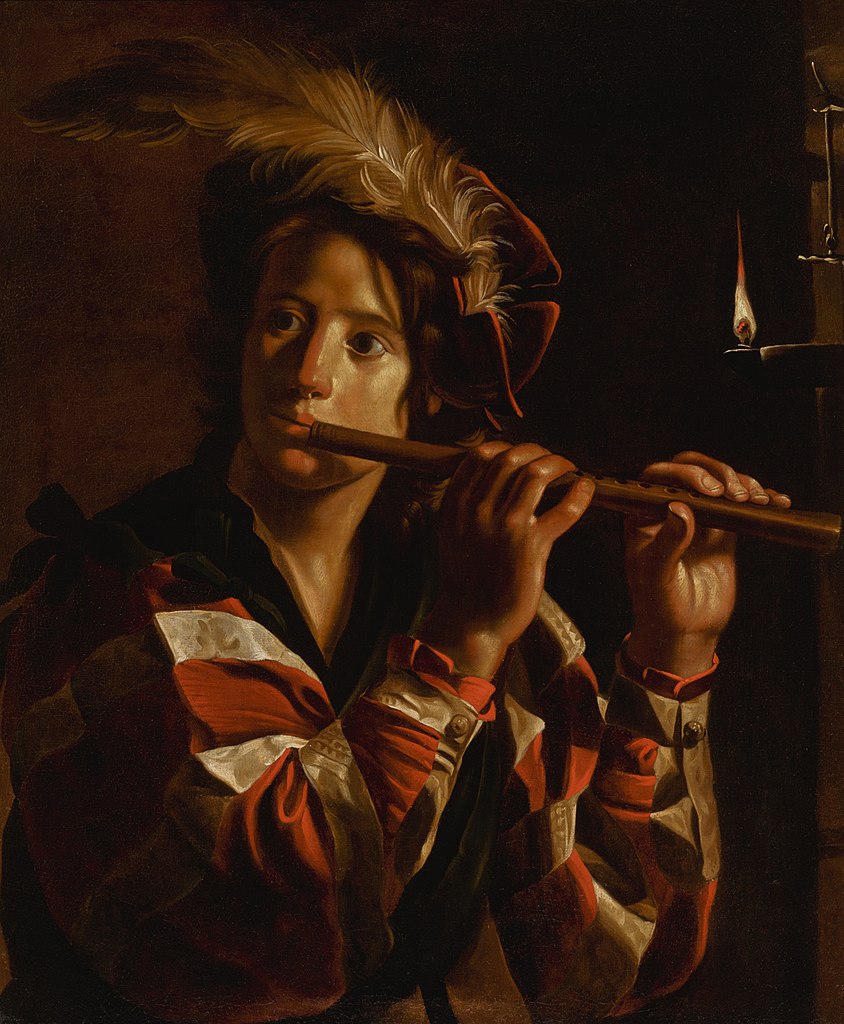 images/Young_man_playing_the_flute.jpg